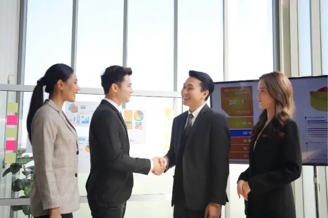Corporate leadership delegation conducting a site visit and meeting with Vietnamese business partners